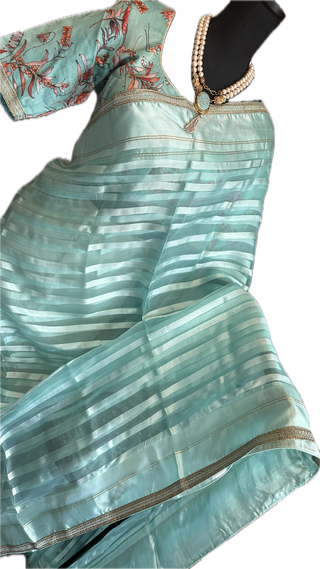 Pastel blue Organza soft weave gold borders with stitched blouse