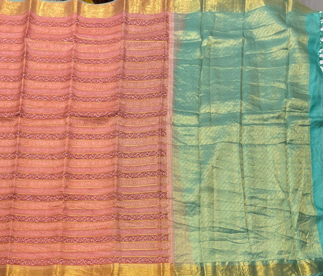 Traditional handwoven Kanchi Pattu saree with rich zari pallu and stitched blouse