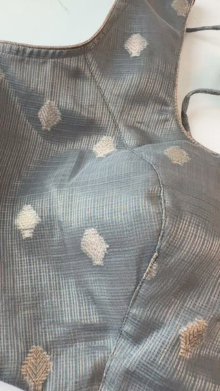 Handcrafted readymade blouse in grey Zari Kota fabric with intricate sleeve detailing, ideal for pairing with Kanjivaram or Banarasi sarees.