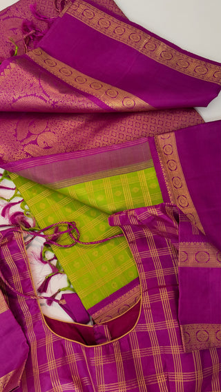 Green kanchi pattusaree with purple embossed zari  blouse