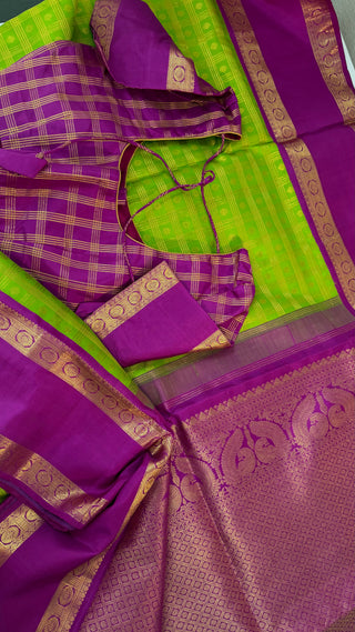 Green kanchi pattusaree with purple embossed zari  blouse