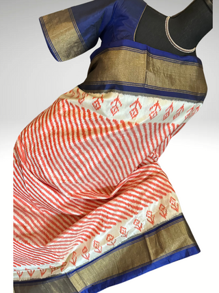 Orange pure ikat silk saree with prestitched blouse pett border