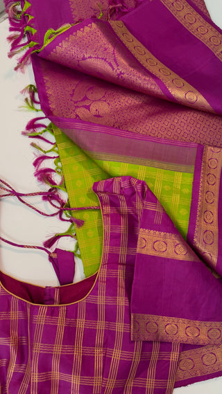 Green kanchi pattusaree with purple embossed zari  blouse