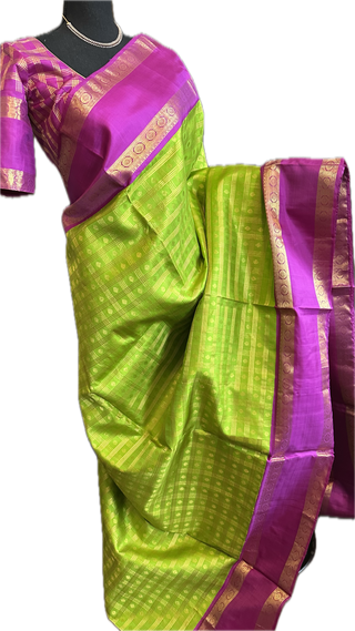 Green kanchi pattusaree with purple embossed zari  blouse