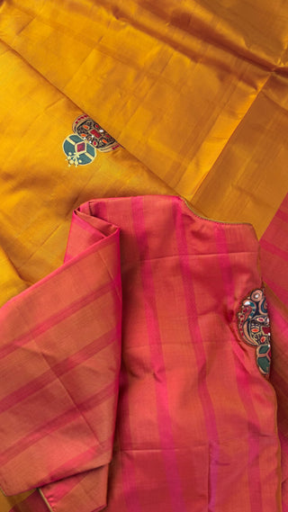 Yellow fabric with pink border and decorative elements on a yellow background