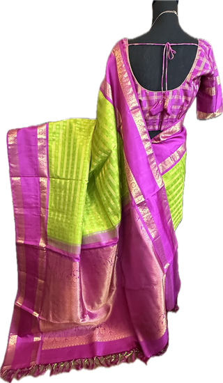 Green kanchi pattusaree with purple embossed zari  blouse