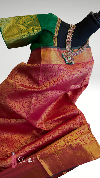 Indian bridal silk saree with rich zari pallu and green contrast blouse