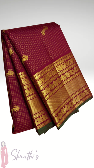 Traditional arakku color Kanjivaram pattu saree with muthu kattam checks pattern
