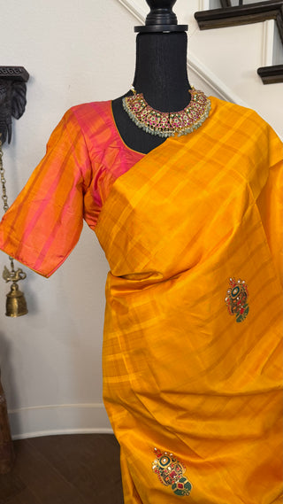 Pure silk kanchi pattu saree paired with brown fully stitched padded blouse