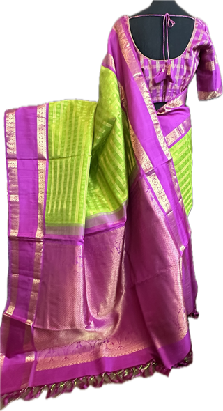 Green kanchi pattusaree with purple embossed zari  blouse