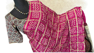 Traditional Bandhani saree with Ajrakh print pallu, lined and padded blouse included.