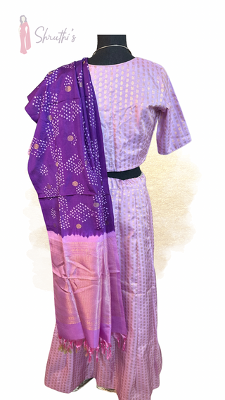 Beautiful Bandhini silk pavadai lehenga adorned with pure Kanjivaram borders and shimmering zari work