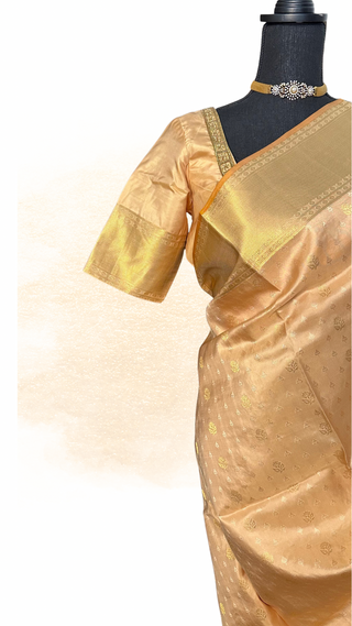 Beige pure Kanjivaram silk saree with stitched embroidered blouse