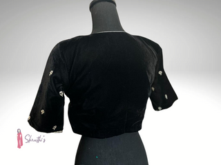 Elegant black velvet readymade blouse with pearl work and elbow sleeves, padded and lined.