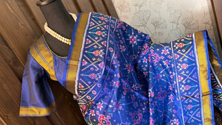 Pure silk blue patola saree with hand embroidered white cream prestitched blouse