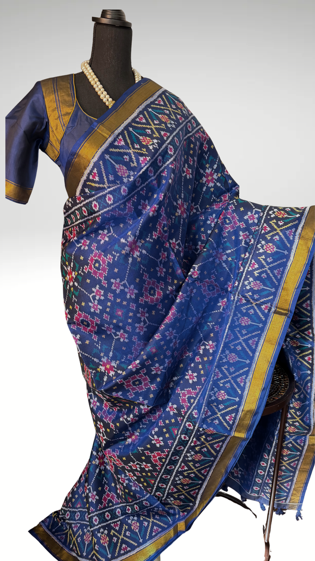 Pure blue patola silk saree with white and gold silk finish pallu and prestitched blouse