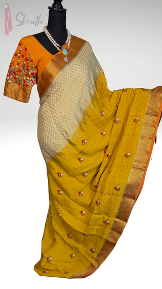 Mustard crepe silk bridal saree featuring high GSM zari and embroidered stitched blouse