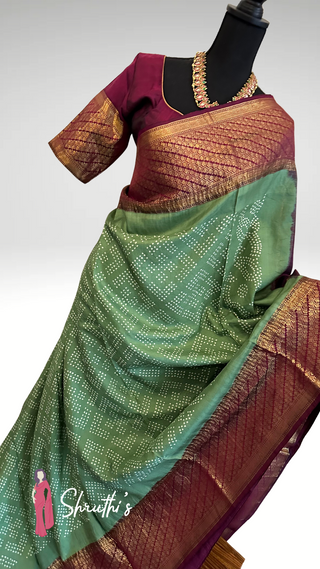 Traditional green and maroon bridal saree with Kanjivaram weave.