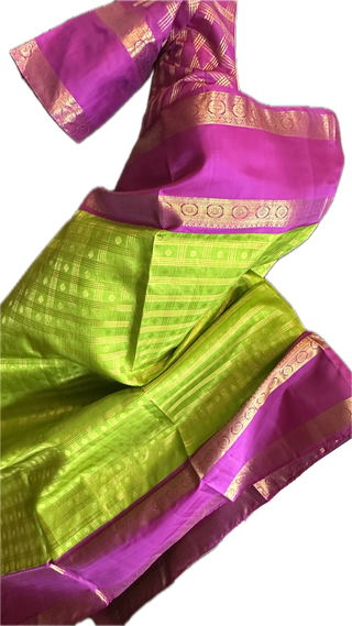 Green kanchi pattusaree with purple embossed zari  blouse