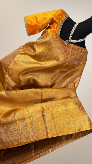 Yellowish Orange color vaira oosi silver zari Pure KANJIVARAM SAREE with Hand embroidered blouse Meenakari borders
