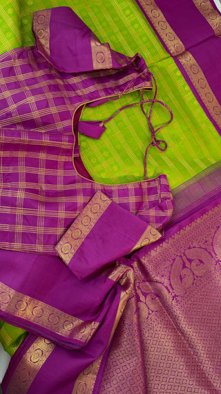 Green kanchi pattusaree with purple embossed zari  blouse