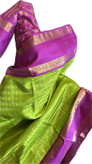 Green kanchi pattusaree with purple embossed zari  blouse