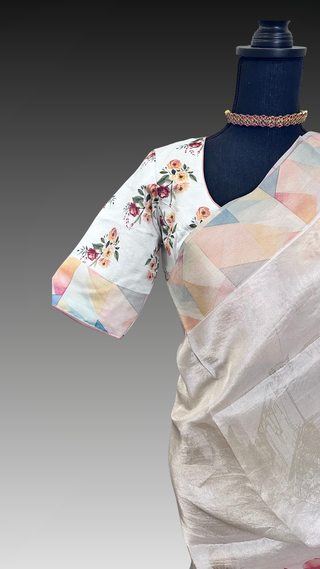 Elegant handloom tissue silk saree in cream shade featuring floral print and stitched blouse