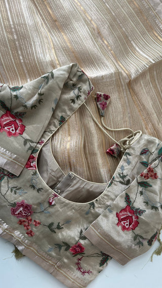 Gold tissue saree with pastel tone and detailed embroidered blouse for partywear.