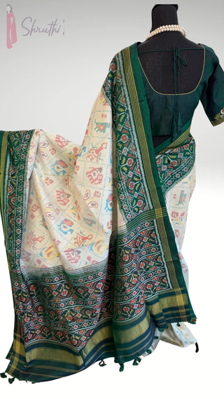 Elegant green Patan Patola saree featuring double ikat weave and premium silk texture