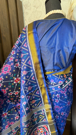 Elegant blue patola silk saree with traditional handloom weaving and rich finish
