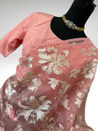Elegant pastel pink organza silk saree with silver embroidery reception wear USA.