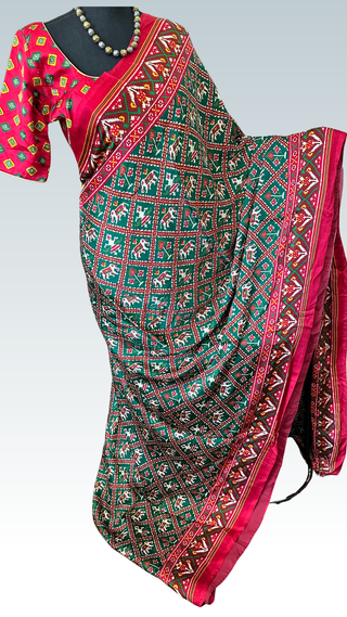 Satin crepe Gajji silk saree featuring traditional ikat prints and smooth texture