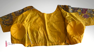 Pure Kalamkari yellow cotton blouse designed with detailed motifs, ideal for sarees