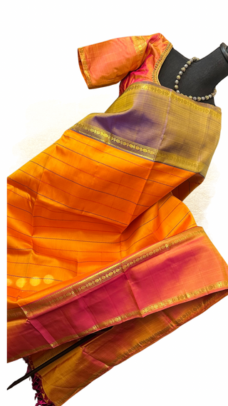 Pure silk Kanjivaram saree in vibrant yellow shade with rich woven border.