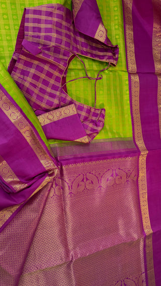 Green kanchi pattusaree with purple embossed zari  blouse