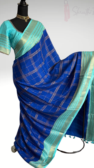 Pure Mysore silk saree easy drape saree available to buy USA online shopping royal blue and turquoise saree with a silver-plated grid pattern and border, displayed on a black mannequin with a matching turquoise blouse.
