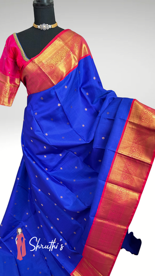 Handwoven Kanjivaram silk saree featuring blue body and pink border.