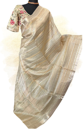 Gold Benaras tissue organza silk saree with embroidered borders and prestitched blouse.