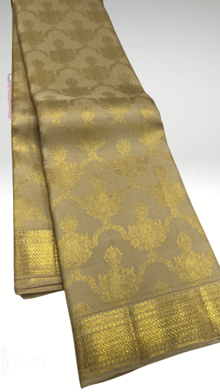 Gold Kanjivaram silk muhurtam saree with antique zari border and hand embroidered blouse for traditional Indian wedding