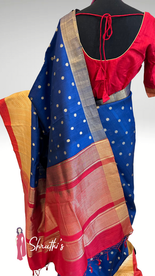 Royal blue Kora organza silk saree with golden zari border and red edge.