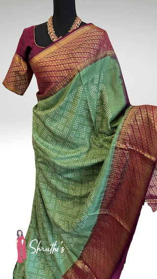 Festive Bandhani silk saree with rich wine-maroon pallu and borders.