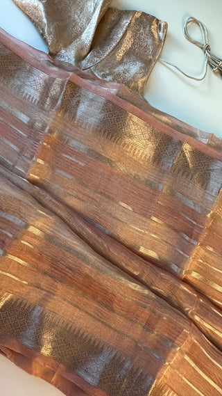 Handcrafted pink Banaras tissue silk saree featuring fine gold zari weaving, fall pico done, and prestitched lined blouse for a perfect fit.