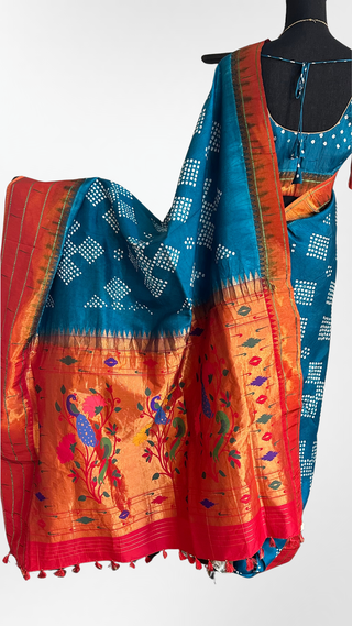 Elegant handloom Bandhani Paithani silk saree featuring tear-drop motifs, copper zari pallu, and prestitched blouse for modern comfort.