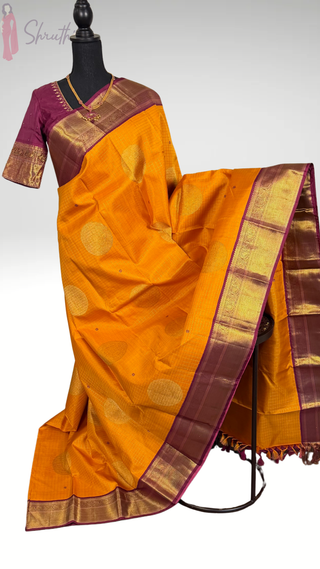 Handloom Kanjivaram yellow silk saree with gold zari and maroon border paired with embroidered stitched blouse for muhurtam kalyana pattu USA.