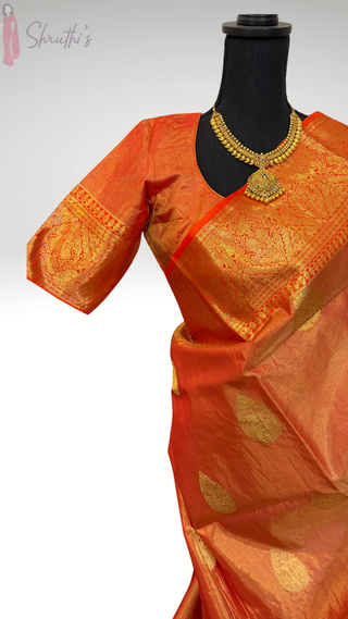 Bridal handloom Kanjivaram red tissue kanchi pattu saree with heavy pallu and stitched padded blouse for muhurtam kalyana pattu, pellicheera pellikuthuru reception wear USA free shipping.