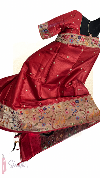 Elegant handloom Tussar silk saree with Paithani-inspired border, intricate silver thread work, and soft drape