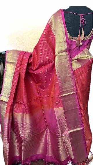 Handwoven pure silk Kanjivaram saree showcasing rich zari weaving and elegant drape for Muhurtam occasions.