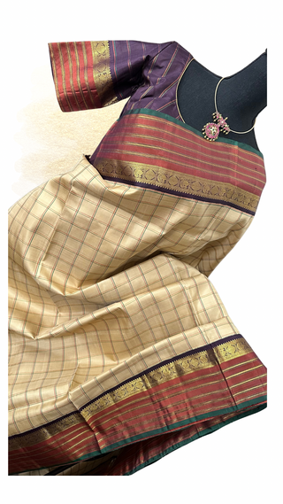 Handwoven Kanjeevaram pure silk saree in Ven Pattu design with intricate zari pallu and border.