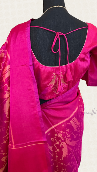Pure Patola silk saree in rich pink shade paired with a hand-embroidered stitched blouse for an elegant festive look.