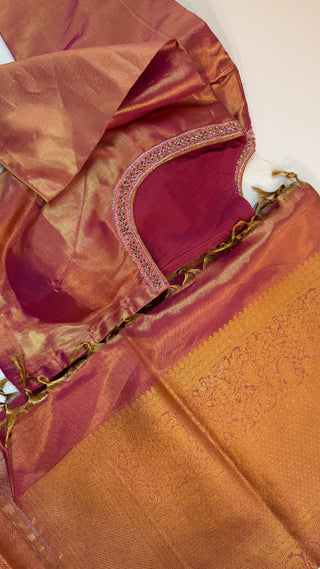 Rose gold Kanchipuram silk saree with fine zari craftsmanship and prestitched blouse.